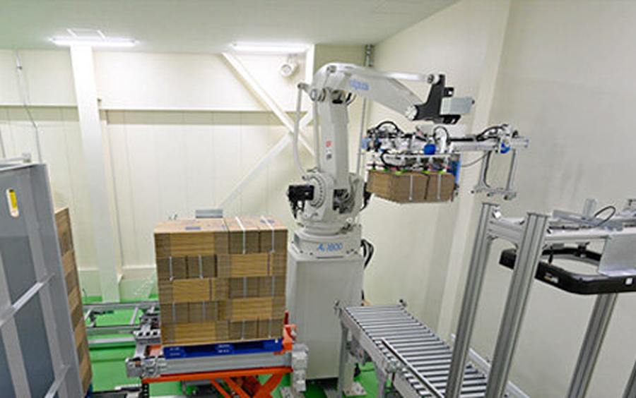 A robotic palletizer that separates bundled cardboard sheets