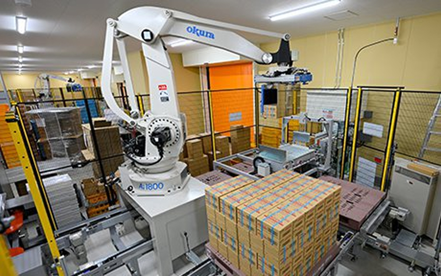 A robot palletizer stacks high-volume products onto pallets